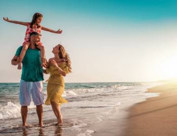 A family playing on the beach in Hilton Head during Labor Day weekend