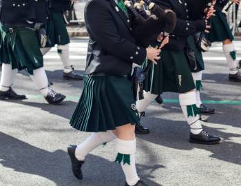 People in kilts marching in the Hilton Head Island St. Patrick's Day Parade