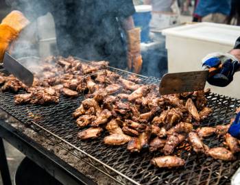 Two cooks grilling wings at Hilton Head Wingfest