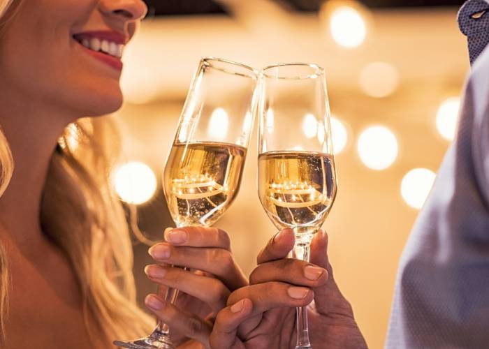 new years eve couple with champagne flutes 